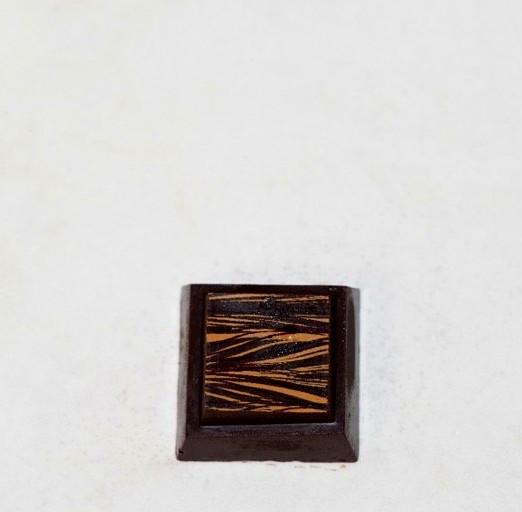 Decorated square handmade chocolate praline